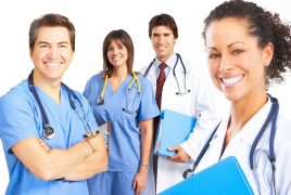 Smiling medical people with stethoscopes. Doctors and nurses over white background